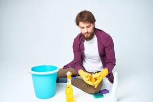 man wearing rubber gloves cleaning interior service professional photo