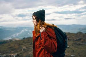 woman mountains landscape clouds sky autumn fresh air tourism travel photo