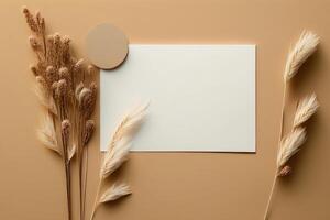 White paper empty blank dried grass decoration on beige. Illustration photo
