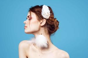 Young woman on blue background close-up photo