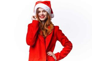 woman wearing santa costume lifestyle holiday christmas light background photo