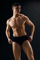 handsome man with muscular body dark panties macho model photo