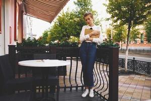 short haired woman on the street vacation in the city summer education photo