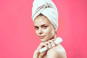 woman with towel on head cleaning skin therapy close-up photo