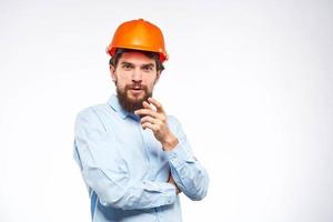 Worker man in orange paint engineer emotions industry construction photo