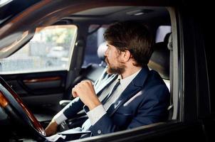 businessmen Driving a car trip luxury lifestyle self confidence photo