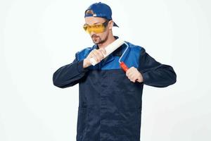 man in working uniform repair painting decorator photo