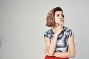 woman in fashionable clothes Red skirt posing Studio photo