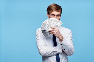 man in white shirt bundle of money wealth dollars finance photo