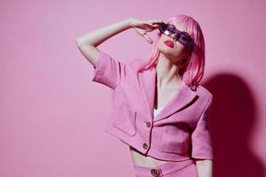 Young positive woman bright makeup pink hair glamor stylish glasses Studio Model unaltered photo