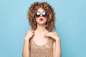 Beautiful woman Curly hair sunglasses lifestyle studio bare shoulders photo