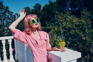 glamorous woman with pink hair summer cocktail refreshing drink Summer day photo