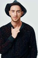 man in black hat black sweater fashion lifestyle close-up