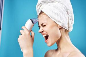 cheerful woman with bare shoulders towel on head skin care dermatology photo