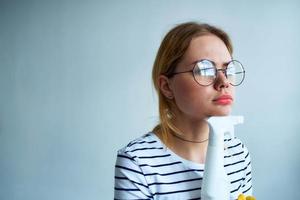 cleaning lady with a sponge in her hands home care service detergent window cleaning photo