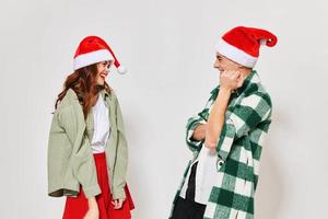 woman standing next to christmas hats communication new year holiday relationship photo