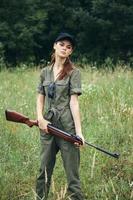 Military woman Gun in hand hunting lifestyle travel fresh air photo