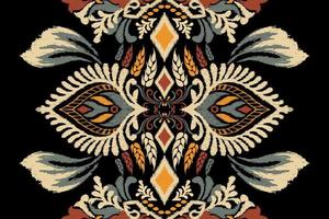 ikat floral cachemir bordado en negro fondo.ikat étnico oriental modelo tradicional.azteca estilo resumen vector ilustración.diseño para textura,tela,ropa,envoltura,decoración,bufanda,alfombra