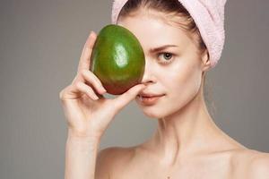 elegant woman mango in hand exotic vitamins clear skin photo