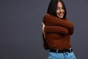 Brunette brown sweater glamor posing smile fashion studio model photo