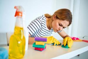 Woman cleans sponge table household cleaning service lifestyle photo