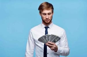 man in white shirt with tie holding money in his hands wealth business photo