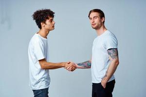 two men friendship shaking hands isolated background photo