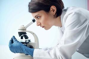 female laboratory assistant looking microscope diagnostics professional science photo