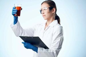 female laboratory assistant research biotechnology professional analyzes photo