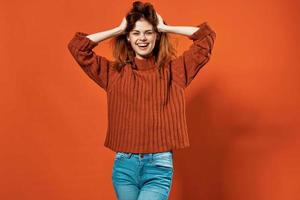 woman with red hair posing hand gestures fun studio photo