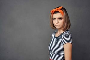 woman in striped t-shirt with orange headband fashion glamor photo
