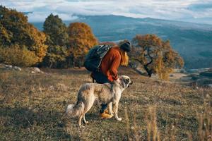 woman tourist next to dog and walk friendship journey photo