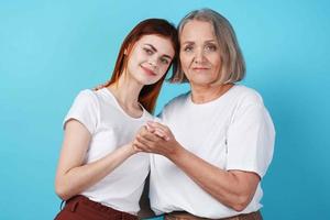 Mom and daughter together communication best blue background photo