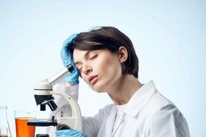 woman scientist microscope diagnostics microbiology professional photo