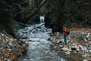 autumn river in the mountains on nature in the forest and travel model tourism photo