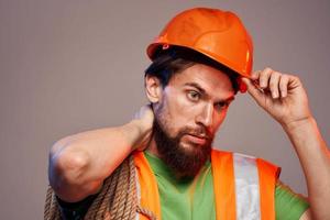 man in construction uniform orange hard hat construction cropped view photo