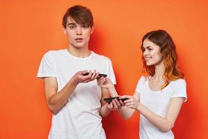 young couple communication phones friendship technology photo