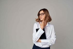 Business woman in white shirt documents professional office photo