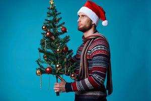 Cheerful man in New Year's clothes advertising copy space studio posing photo