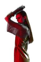 attractive woman red light silver armor chain mail fashion blue background photo