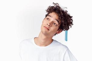 emotional man with comb curly hair close-up photo