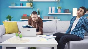 Excited teenage brothers watch hidden inappropriate video at home from their parents.