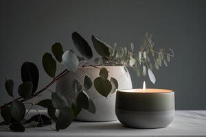 Eucalyptus leaf branch in white bowl and burning candle. Illustration photo