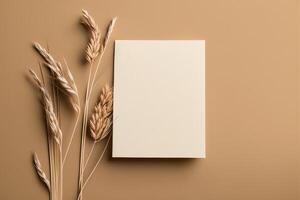 White paper empty blank dried grass decoration on beige. Illustration photo