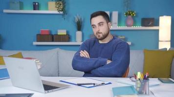 Man working in home office thinking of ingenious idea. Man working in home office looks around thinking to come up with an idea. video