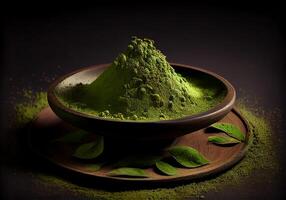 Pile of green matcha tea powder in a flat plate on the table. loose ingredient. photo