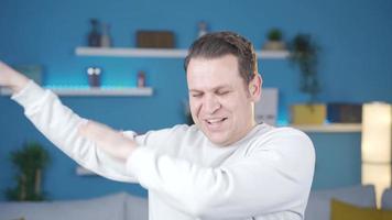 Enthusiastic dancing adult man having fun at home, being happy like a child. Fun man at home dancing, having fun, happy and cute alone. video