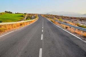 Road through the scenic landscape photo