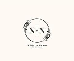 initial NN letters hand drawn feminine and floral botanical logo suitable for spa salon skin hair beauty boutique and cosmetic company. vector