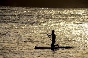 Surfing in the ocean photo